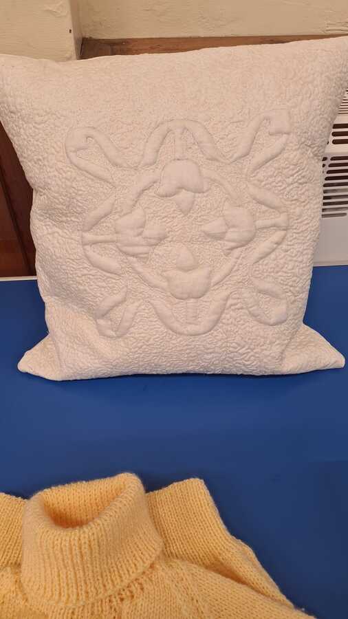 Trapunto cushion cover by Evelyn